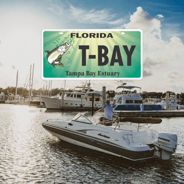 A man on a boat. A graphic of the Tampa Bay Specialty License Plate is layered atop the image. 